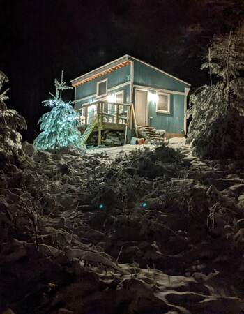 My Tiny house at night in the snow